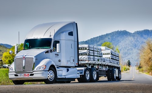 A flatbed truck on the road