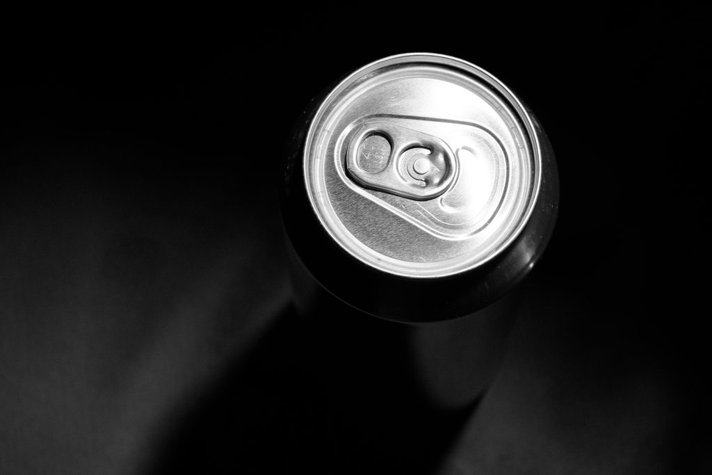 Light shines down on an aluminum can top
